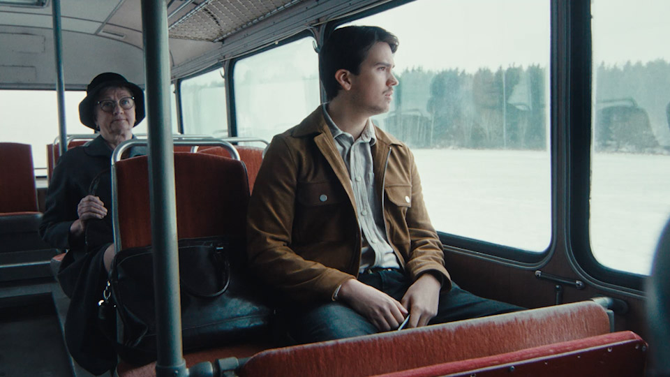 Guy in old bus on the countryside. Commercial